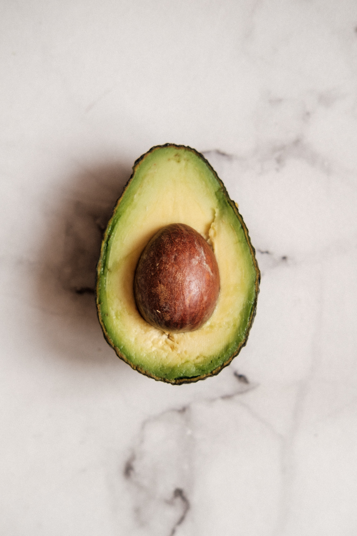 Half Avocado on the Table