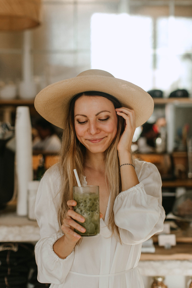 Woman Holding A Drink