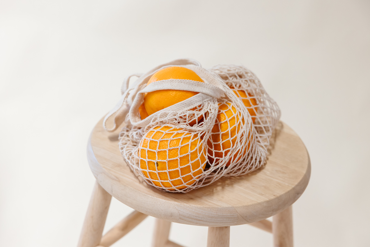 Oranges in a Mesh Bag 